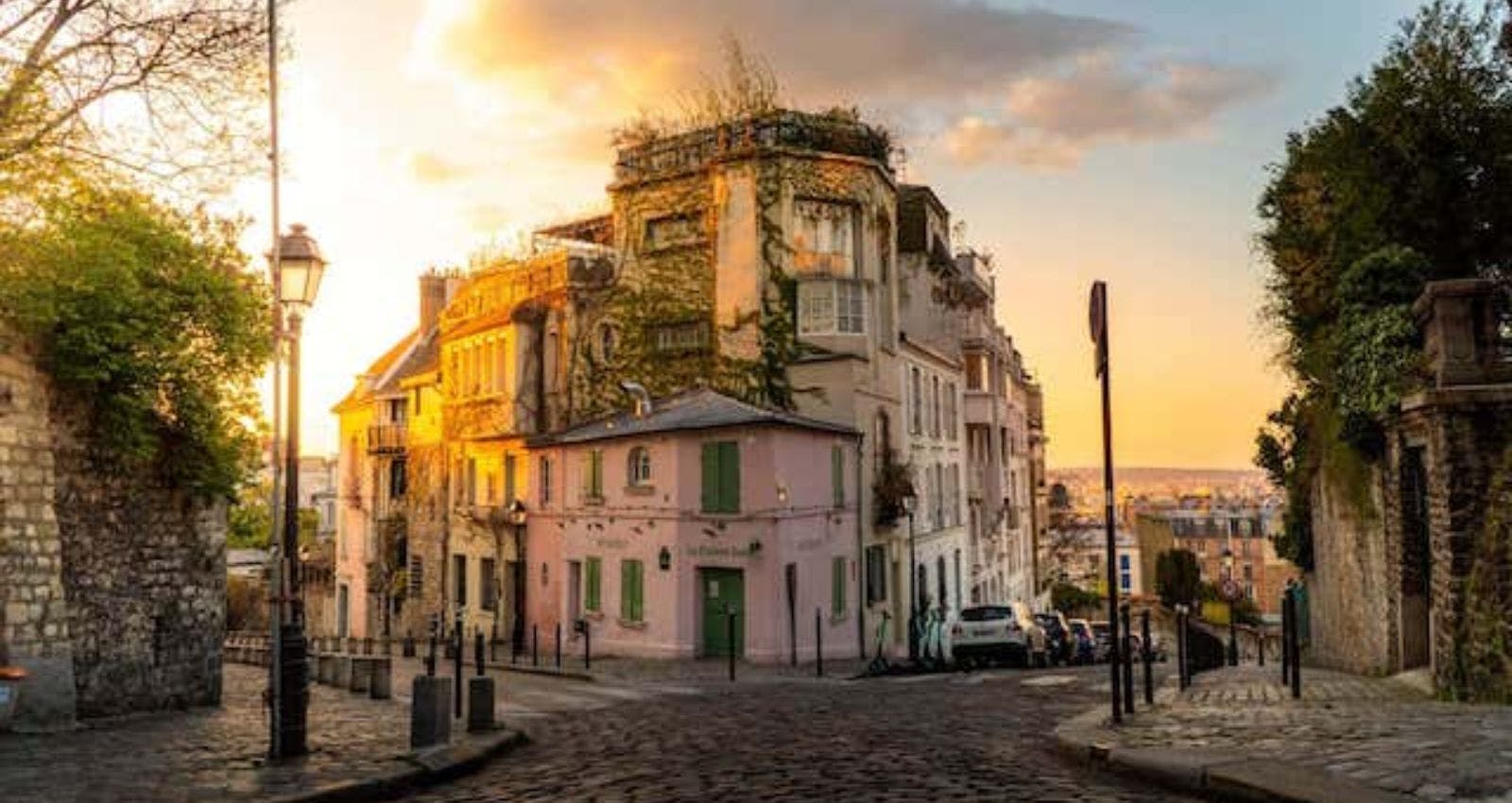 Beautiful houses of Montmartre Hill in Paris by sunny weather